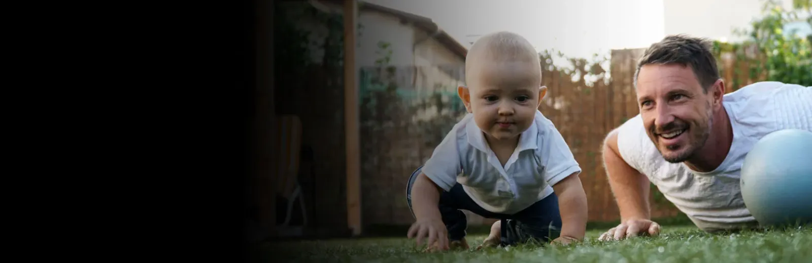 Father and baby playing outside mosquito free yard